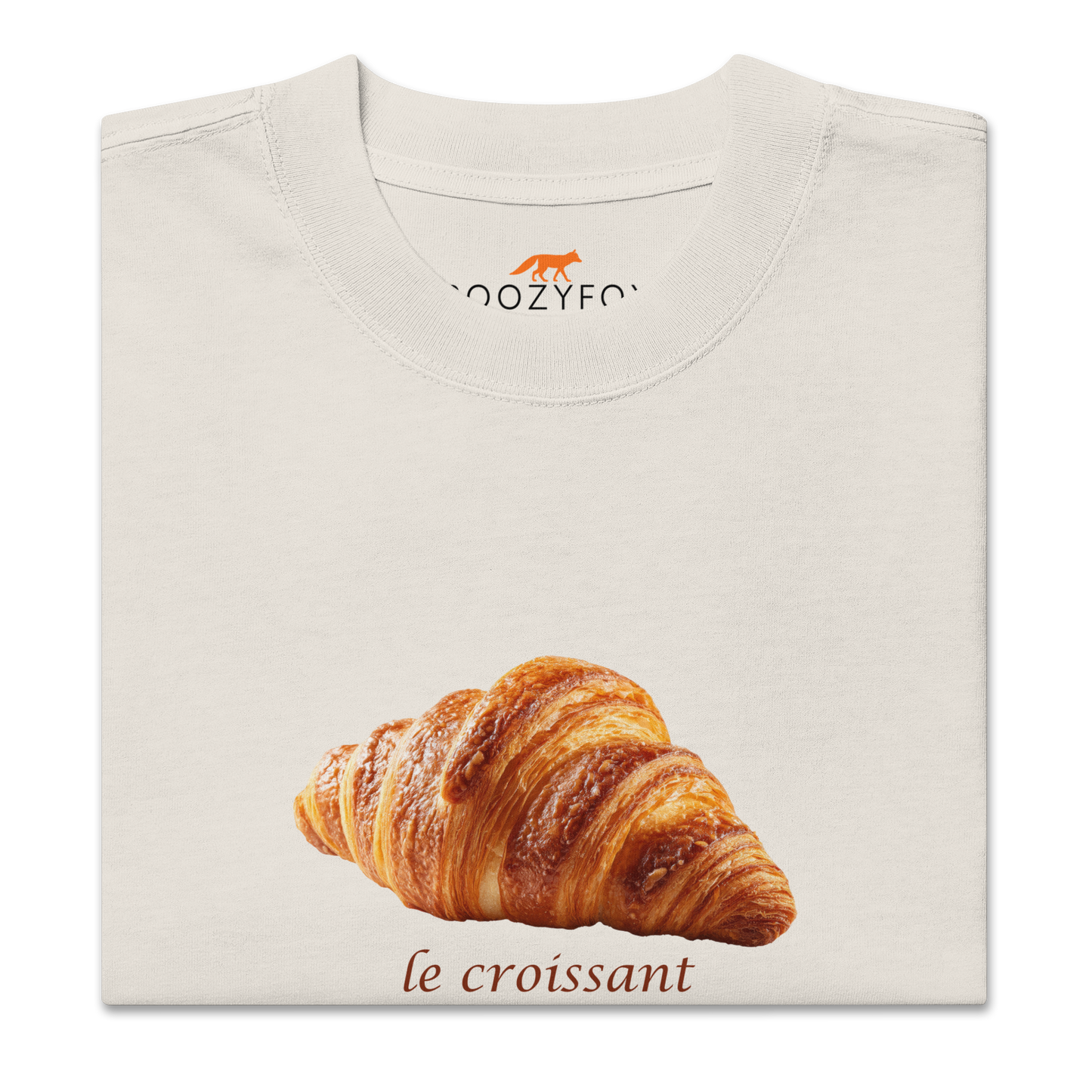 Product details of a Funny Le Croissant oversized graphic t-shirt in faded bone white by Boozy Fox