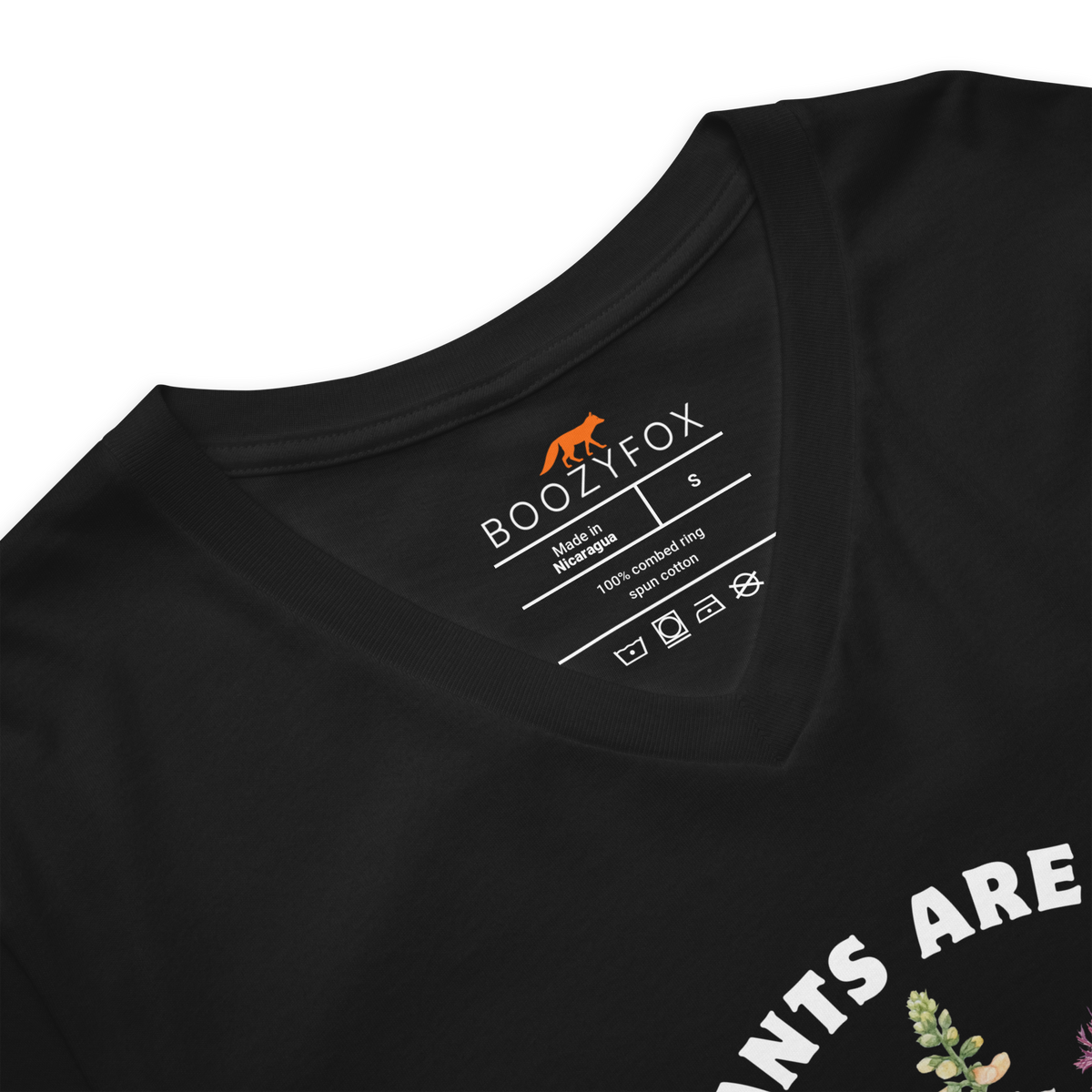 Close-up detail of black v-neck t-shirt collar and Boozy Fox neck label