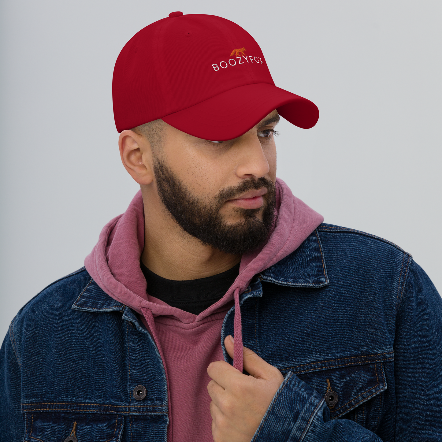 Man Wearing a Cranberry Red Dad Hat - Boozy Fox