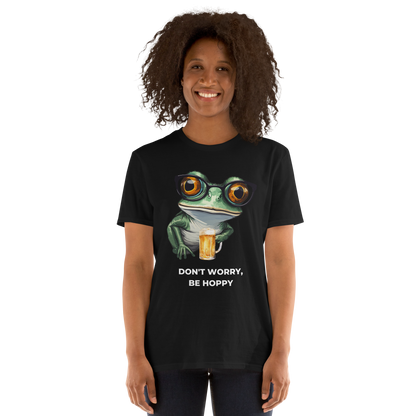 Smiling woman wearing a Black Frog T-Shirt featuring a ribbitting Don't Worry, Be Hoppy graphic on the chest - Funny Graphic Frog T-Shirts - Boozy Fox