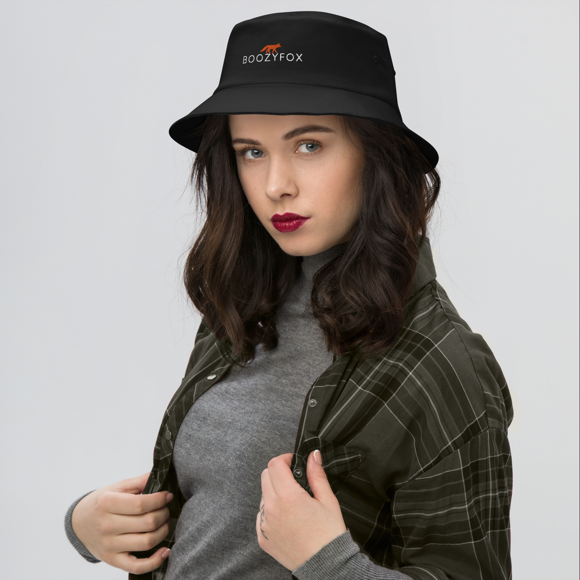 Woman wearing a Cool Black Bucket Hat featuring a striking embroidered Boozy Fox logo on front. Shop Cool Sun Protection Bucket Hats And Wide Brim Hats Online - Boozy Fox
