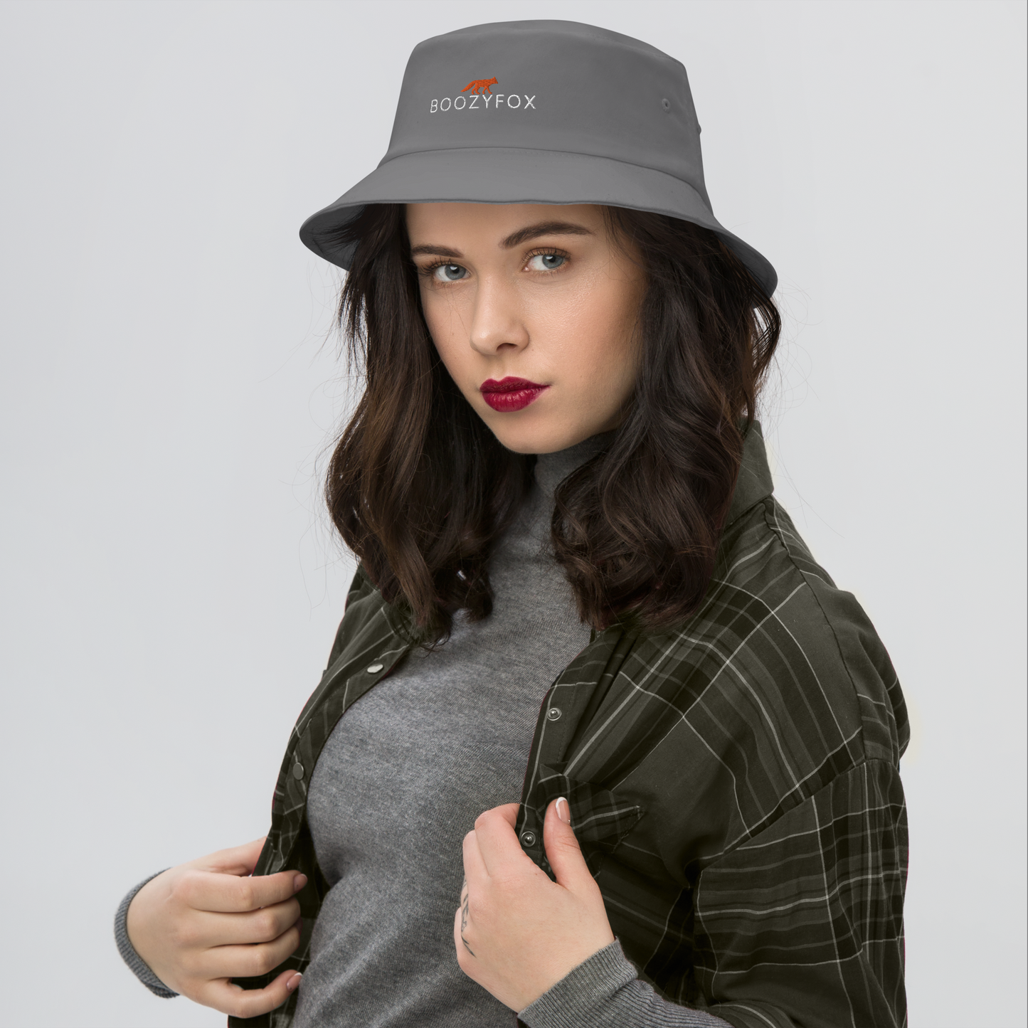 Woman wearing a Cool Grey Bucket Hat featuring a striking embroidered Boozy Fox logo on front. Shop Cool Sun Protection Bucket Hats And Wide Brim Hats Online - Boozy Fox