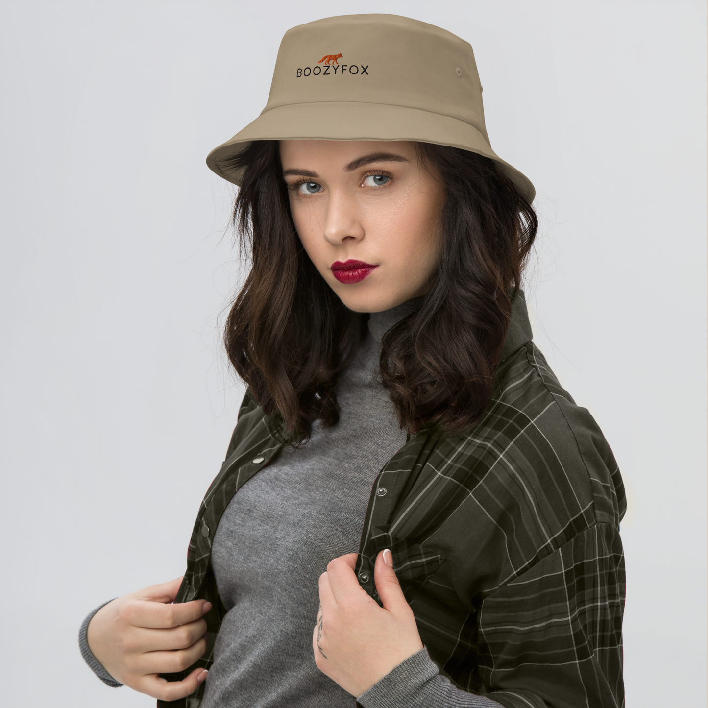 Woman wearing a Cool Khaki Bucket Hat featuring a striking embroidered Boozy Fox logo on front. Shop Cool Sun Protection Bucket Hats And Wide Brim Hats Online - Boozy Fox