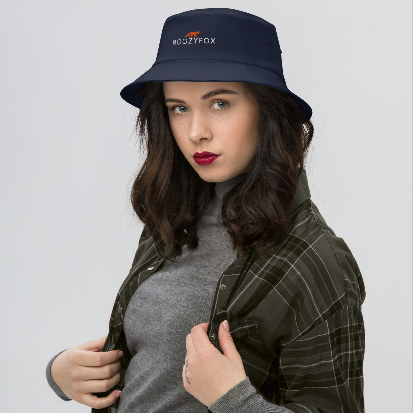 Woman wearing a Cool Navy Bucket Hat featuring a striking embroidered Boozy Fox logo on front. Shop Cool Sun Protection Bucket Hats And Wide Brim Hats Online - Boozy Fox
