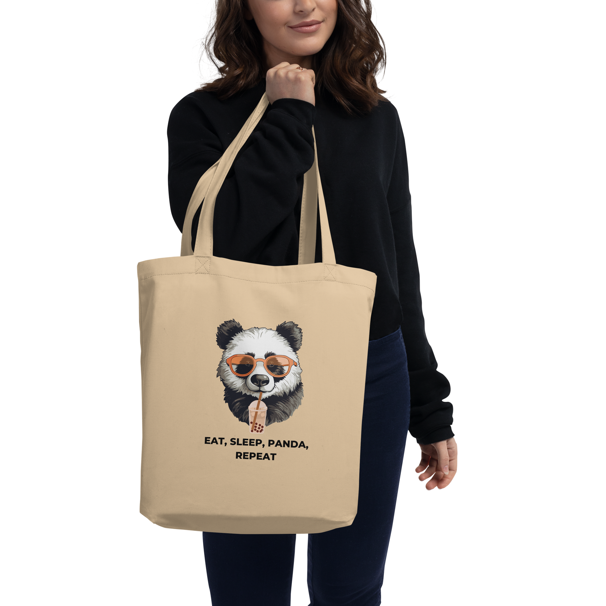 Woman carrying a Oyster Colored Panda Eco Tote Bag featuring a hilarious Eat, Sleep, Panda, Repeat graphic - Funny Organic Cotton Totes - Boozy Fox