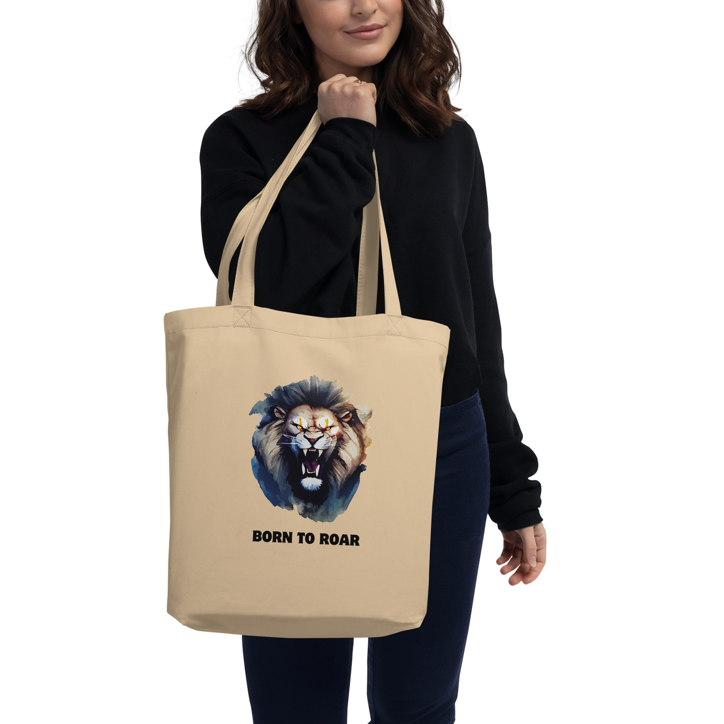 Woman carrying a Funny Born to Roar Lion Eco Tote Bag in oyster by Boozy Fox