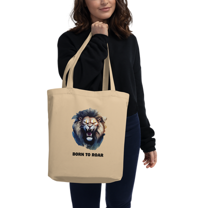Woman carrying a Funny Born to Roar Lion Eco Tote Bag in oyster by Boozy Fox