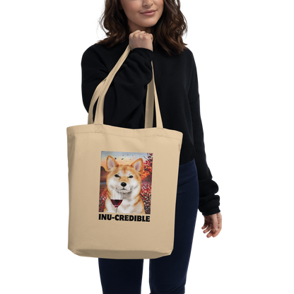 Woman carrying a oyster colored Shiba Inu Eco Tote Bag featuring a Inu-Credible Shiba Inu graphic - Shop Funny Organic Cotton Tote Bags Online - Boozy Fox