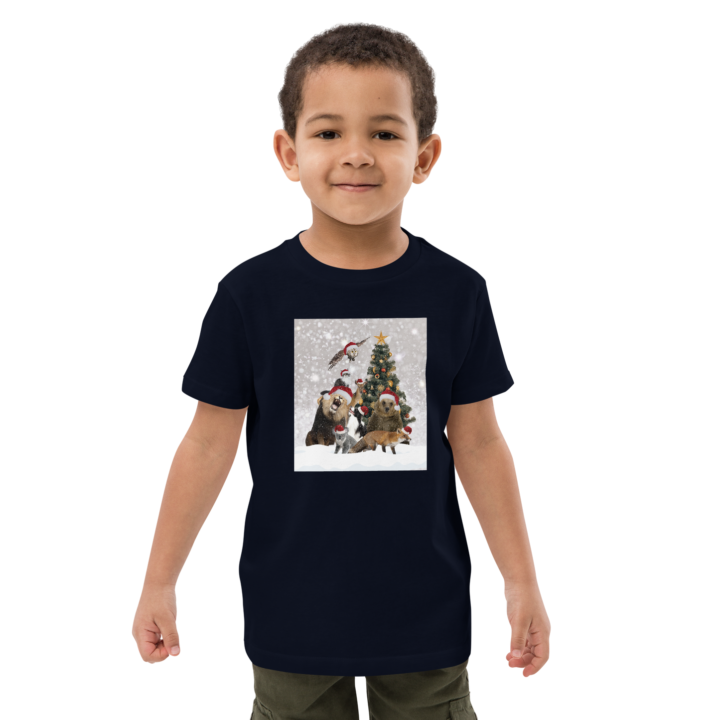 Young boy wearing a French Navy Christmas Animals Organic Cotton Kids T-Shirt featuring a delightful Christmas Tree Surrounded by Adorable Animals graphic on the chest - Kids' Graphic Tees - Funny Christmas Tee Shirts - Boozy Fox