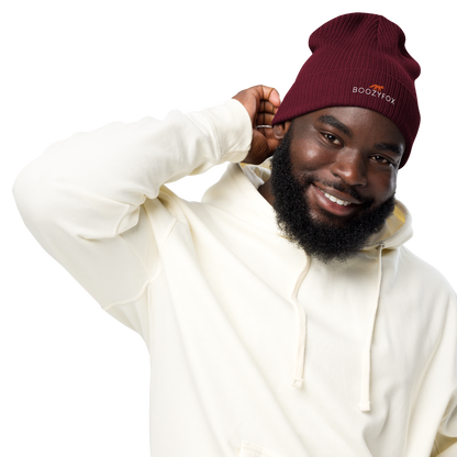 Smiling man wearing a Burgundy Organic Ribbed Beanie With An Embroidered Boozy Fox Logo On Fold - Shop Organic Cotton Beanies Online - Boozy Fox