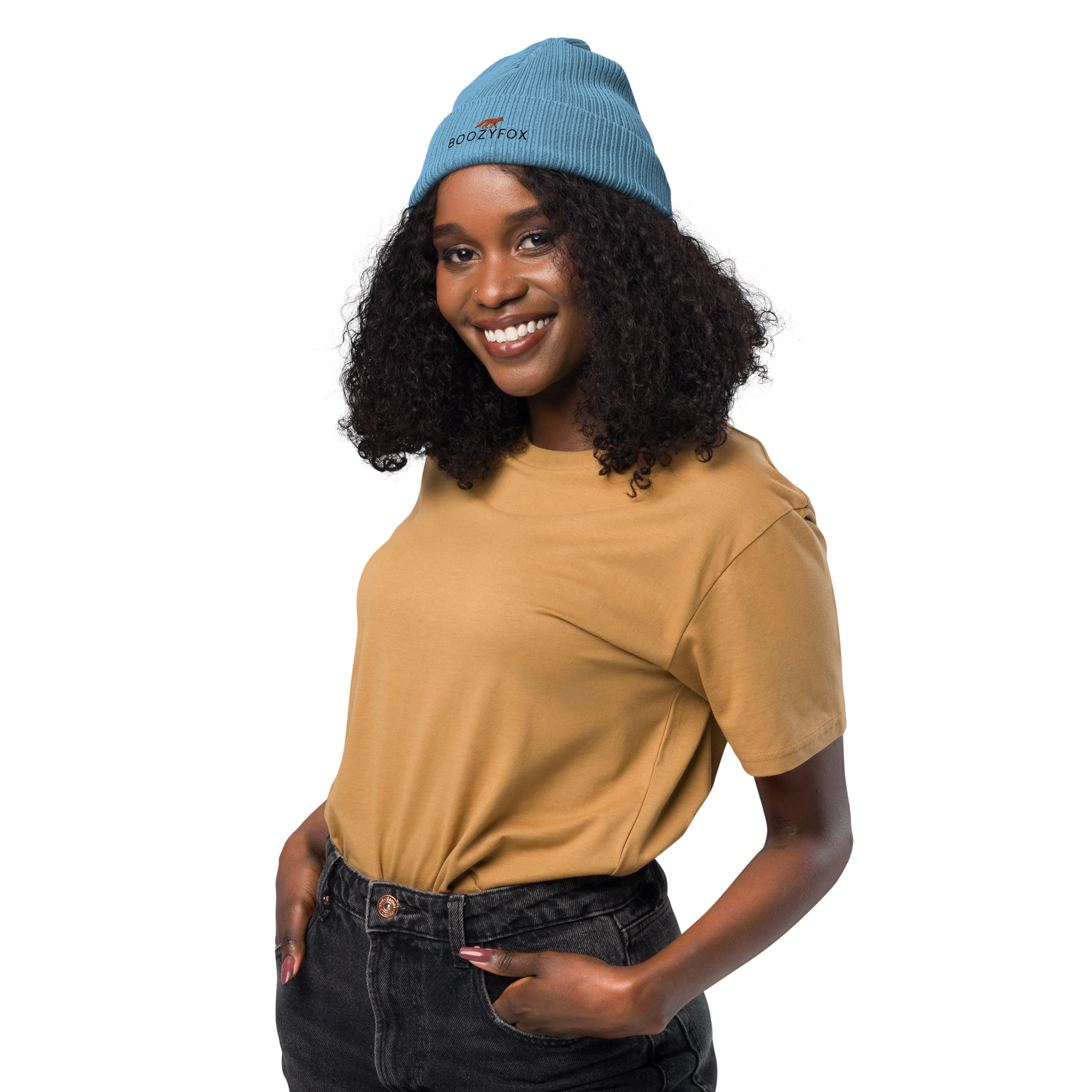 Smiling woman wearing a Light Avio Blue Organic Ribbed Beanie With An Embroidered Boozy Fox Logo On Fold - Shop Organic Cotton Beanies Online - Boozy Fox