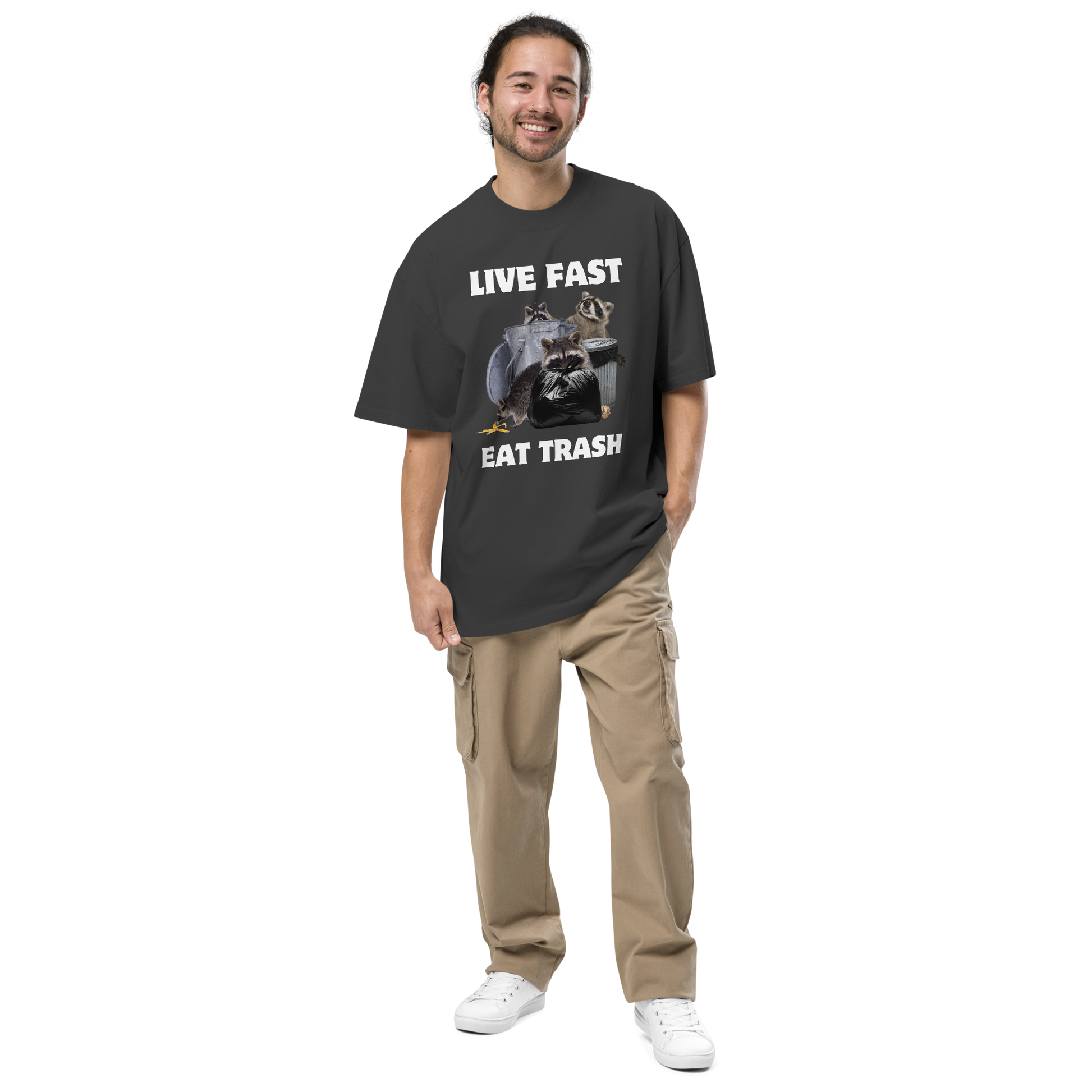 Smiling man wearing a Faded Black Raccoon Oversized T-Shirt featuring the bold Live Fast Eat Trash graphic on the chest - Funny Graphic Raccoon Oversized Tees - Boozy Fox