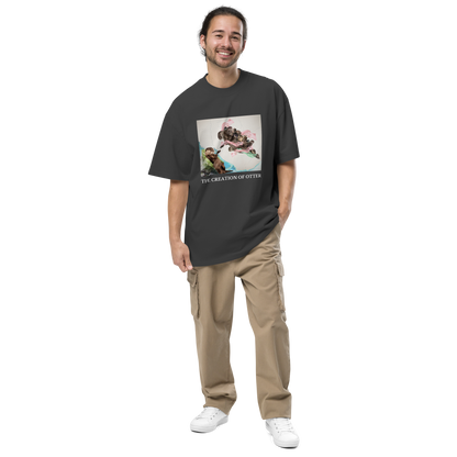 Man wearing a Faded Black The Creation of Otter Oversized Tee - Boozy Fox