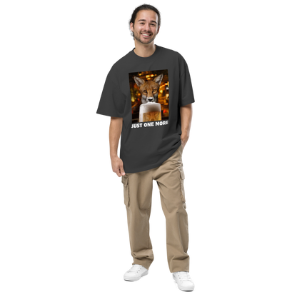 Man wearing a Funny Just One More Fox oversized graphic t-shirt in faded black by Boozy Fox