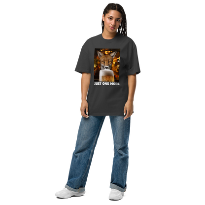 Woman wearing a Funny Just One More Fox oversized graphic t-shirt in faded black by Boozy Fox