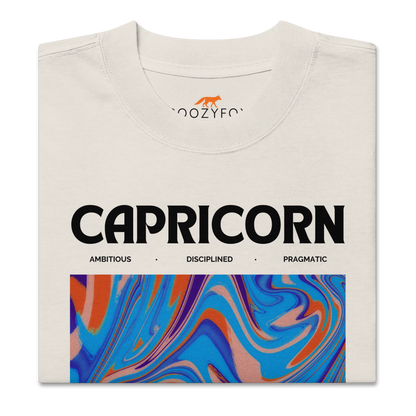 Front details of a Faded Bone Capricorn Oversized T-Shirt featuring an Abstract Capricorn Star Sign graphic on the chest - Cool Graphic Zodiac Oversized Tees - Boozy Fox