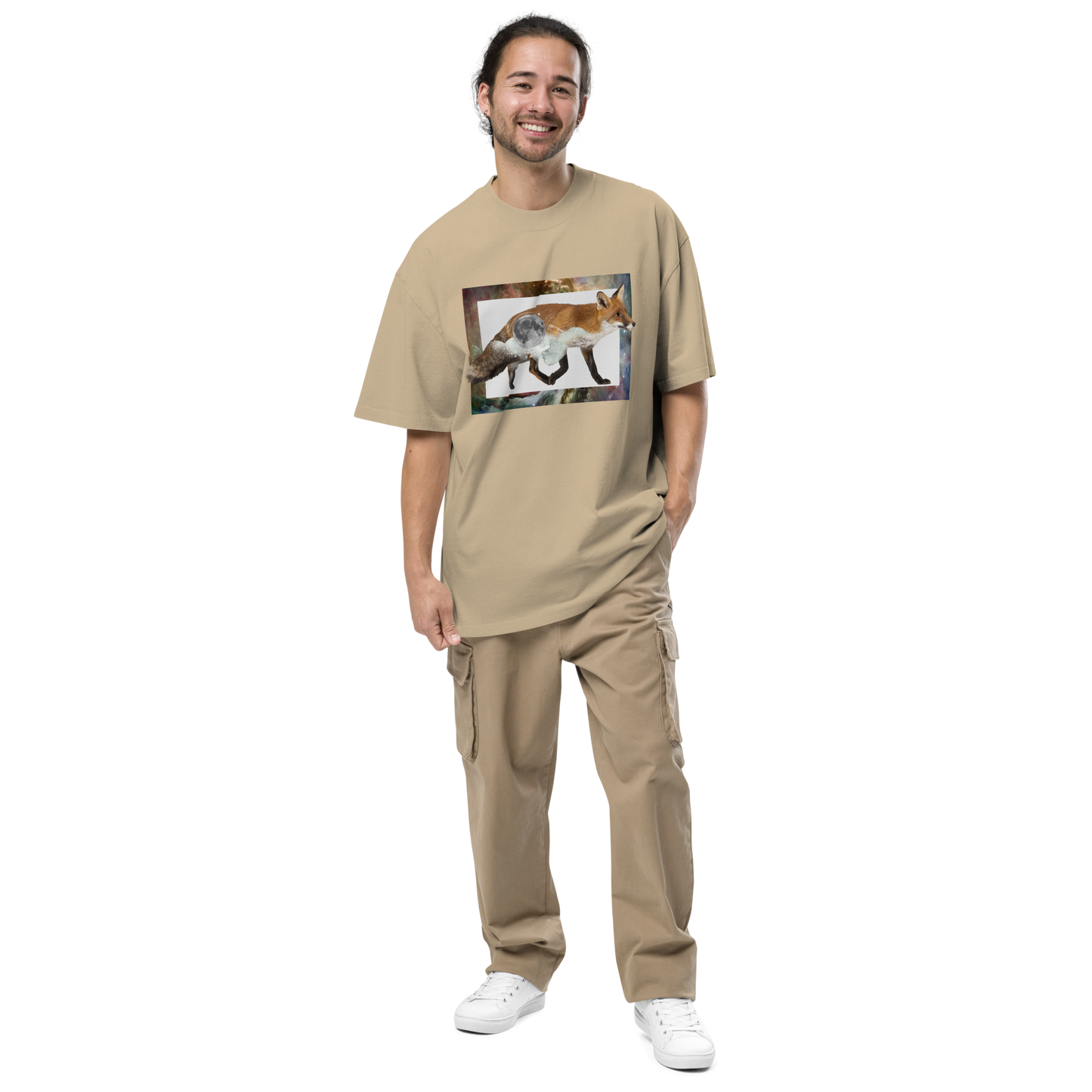 Smiling man wearing a Faded Khaki Fox Oversized T-Shirt featuring a stellar Space Fox graphic on the chest - Cool Graphic Fox Oversized Tees - Boozy Fox
