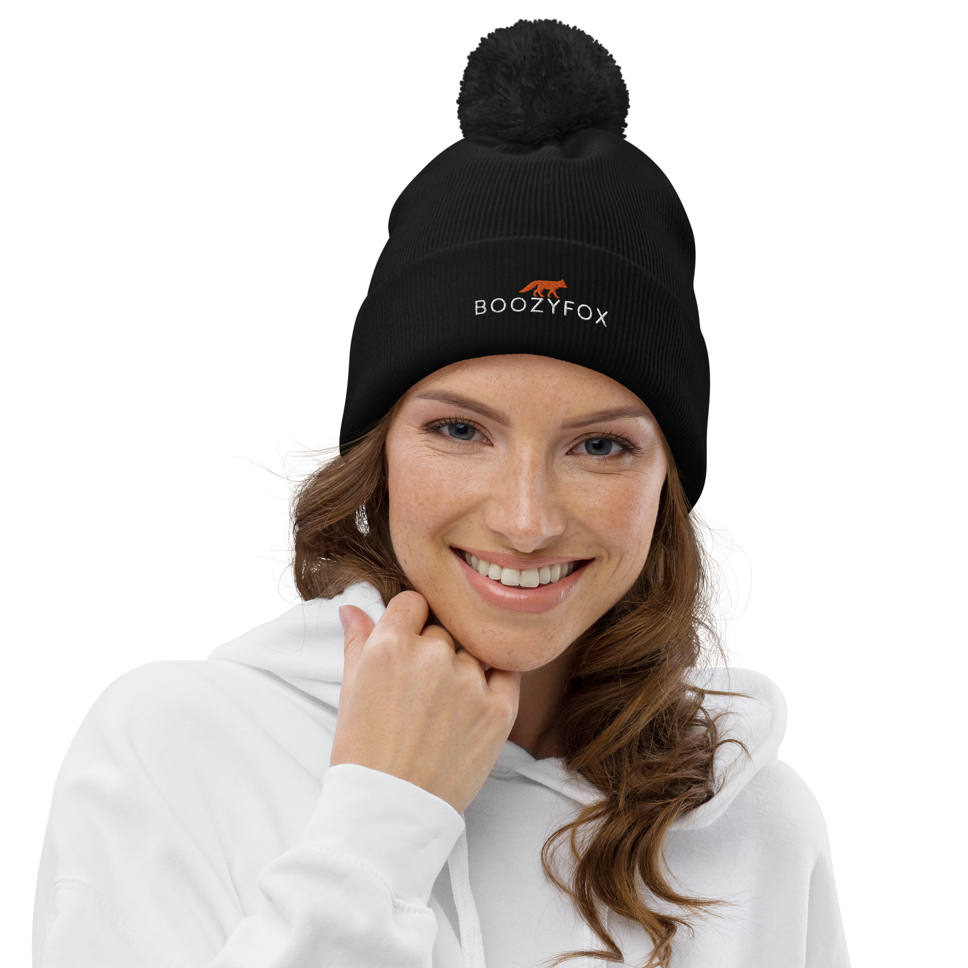 Smiling woman wearing a Black Pom-Pom Beanie With An Embroidered Boozy Fox Logo On Fold - Shop Pom-Pom Beanies Online - Boozy Fox