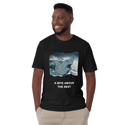 Smiling man wearing a Black Megalodon T-Shirt featuring A Bite Above the Rest graphic on the chest - Funny Graphic Megalodon T-Shirts - Boozy Fox