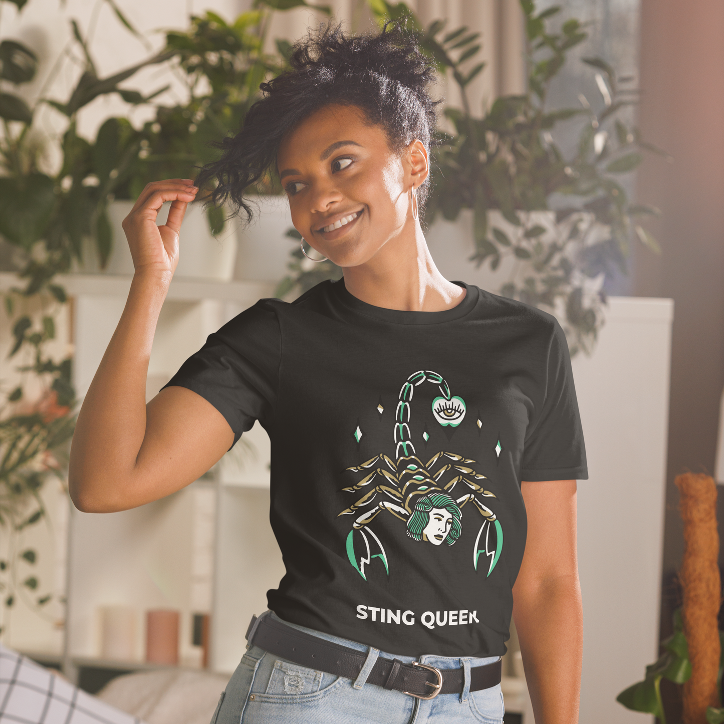 Smiling woman wearing a Black Scorpion T-Shirt featuring the Sting Queen graphic on the chest - Cool Graphic Scorpion T-Shirts - Boozy Fox
