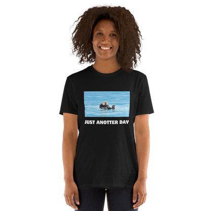 Smiling woman wearing a black Just Anotter Day Otter T-Shirt - Boozy Fox