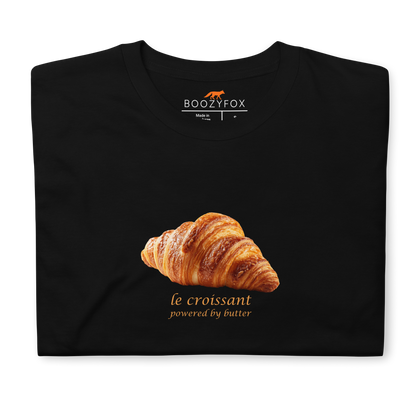 Front details of a Funny Le Croissant graphic t-shirt in black by Boozy Fox