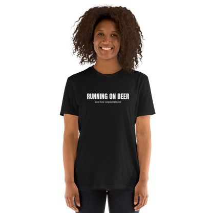 Woman wearing a Funny Running on Beer graphic t-shirt in black by Boozy Fox