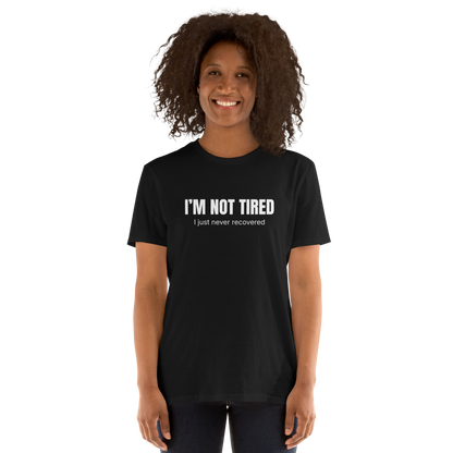 Woman wearing a Funny Not Tired graphic t-shirt in black by Boozy Fox
