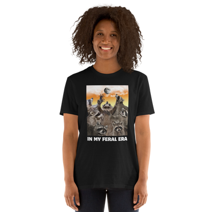 Woman wearing a Funny In My Feral Era Raccoon graphic t-shirt in black by Boozy Fox