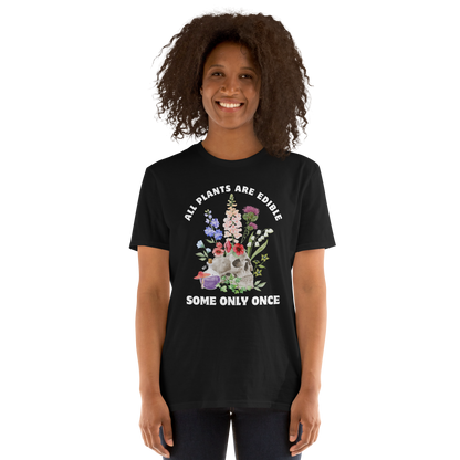 Woman wearing a Funny All Plants Are Edible Some Only Once Plant graphic t-shirt in black by Boozy Fox