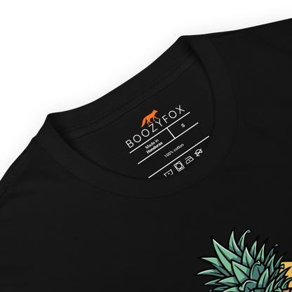 Product details of a Black Tropical Mayhem T-Shirt featuring a Crazy Pineapple Skull graphic on the chest - Funny Graphic Pineapple T-Shirts - Boozy Fox