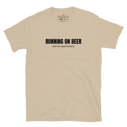 Funny Running on Beer graphic t-shirt in sand by Boozy Fox