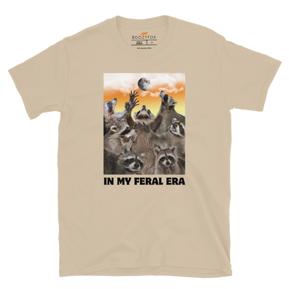 Funny In My Feral Era Raccoon graphic t-shirt in sand by Boozy Fox