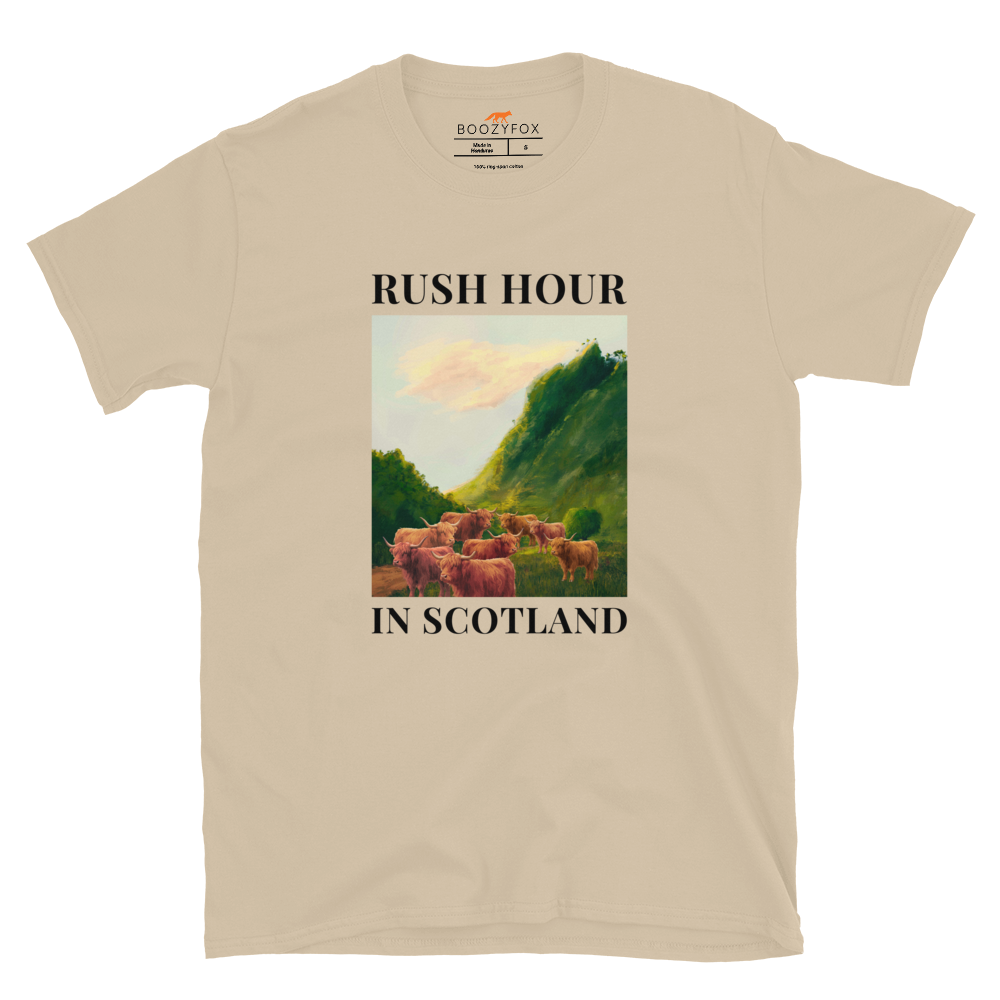 Funny Highland Cow Rush Hour in Scotland graphic t-shirt in sand by Boozy Fox
