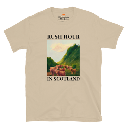 Funny Highland Cow Rush Hour in Scotland graphic t-shirt in sand by Boozy Fox