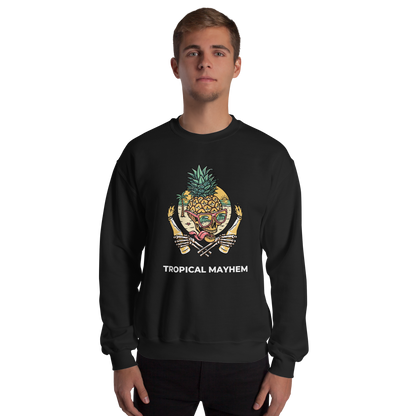 Man wearing a Black Tropical Mayhem Sweatshirt featuring a Crazy Pineapple Skull graphic on the chest - Funny Graphic Pineapple Sweatshirts - Boozy Fox