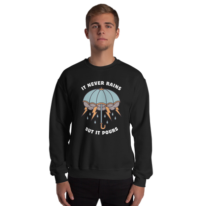 Man wearing a Black Umbrella Sweatshirt featuring a unique It Never Rains But It Pours graphic on the chest - Cool Tattoo-Inspired Graphic Umbrella Sweatshirts - Boozy Fox