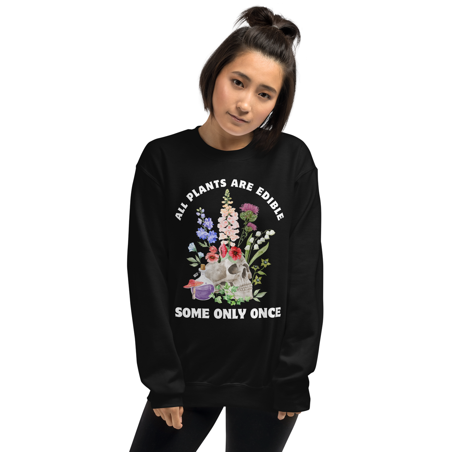 Woman wearing a Funny All Plants Are Edible Some Only Once Plant graphic sweatshirt in black by Boozy Fox