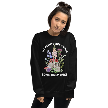 Woman wearing a Funny All Plants Are Edible Some Only Once Plant graphic sweatshirt in black by Boozy Fox