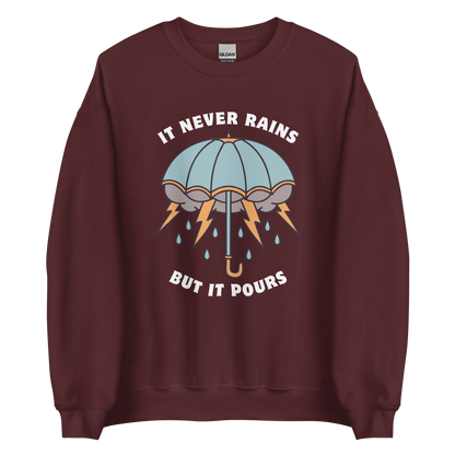 Maroon Umbrella Sweatshirt featuring a unique It Never Rains But It Pours graphic on the chest - Cool Tattoo-Inspired Graphic Umbrella Sweatshirts - Boozy Fox