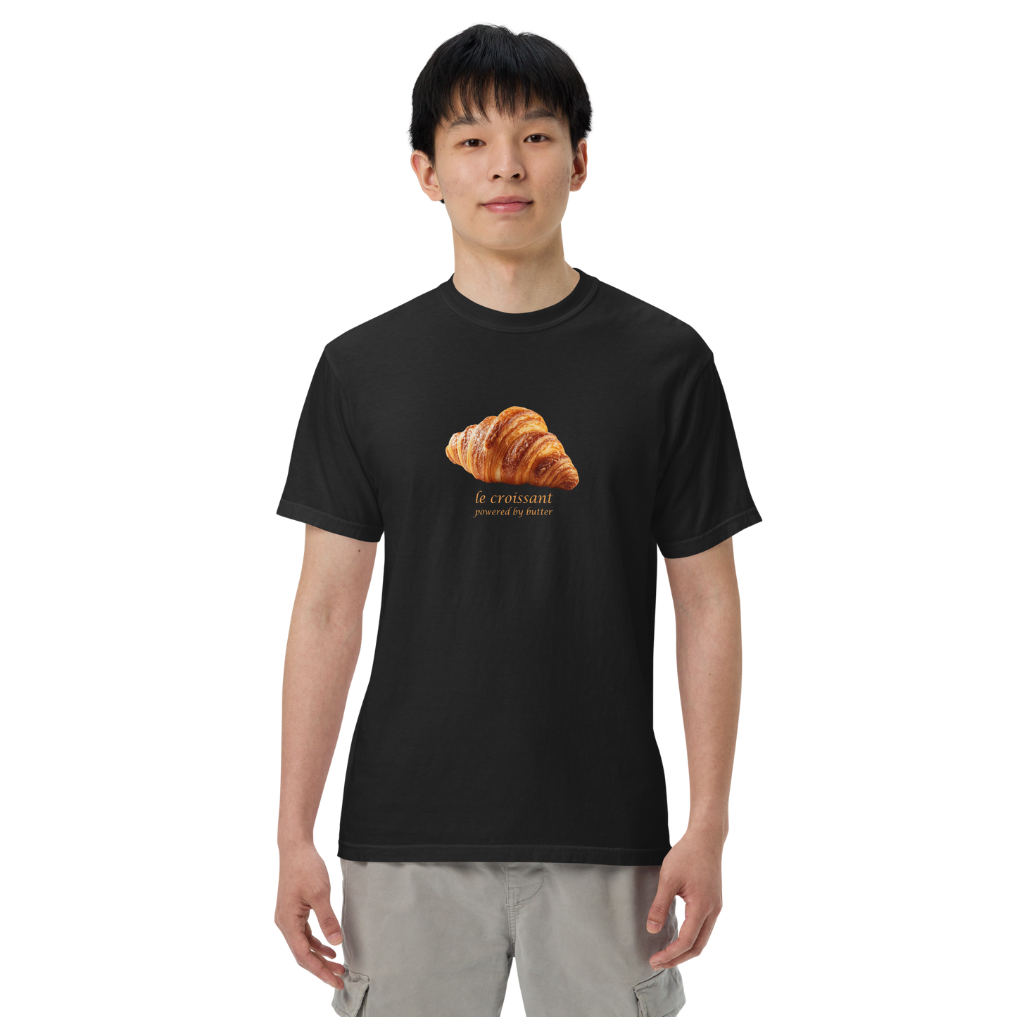 Man wearing a Funny Le Croissant heavyweight graphic t-shirt in black by Boozy Fox