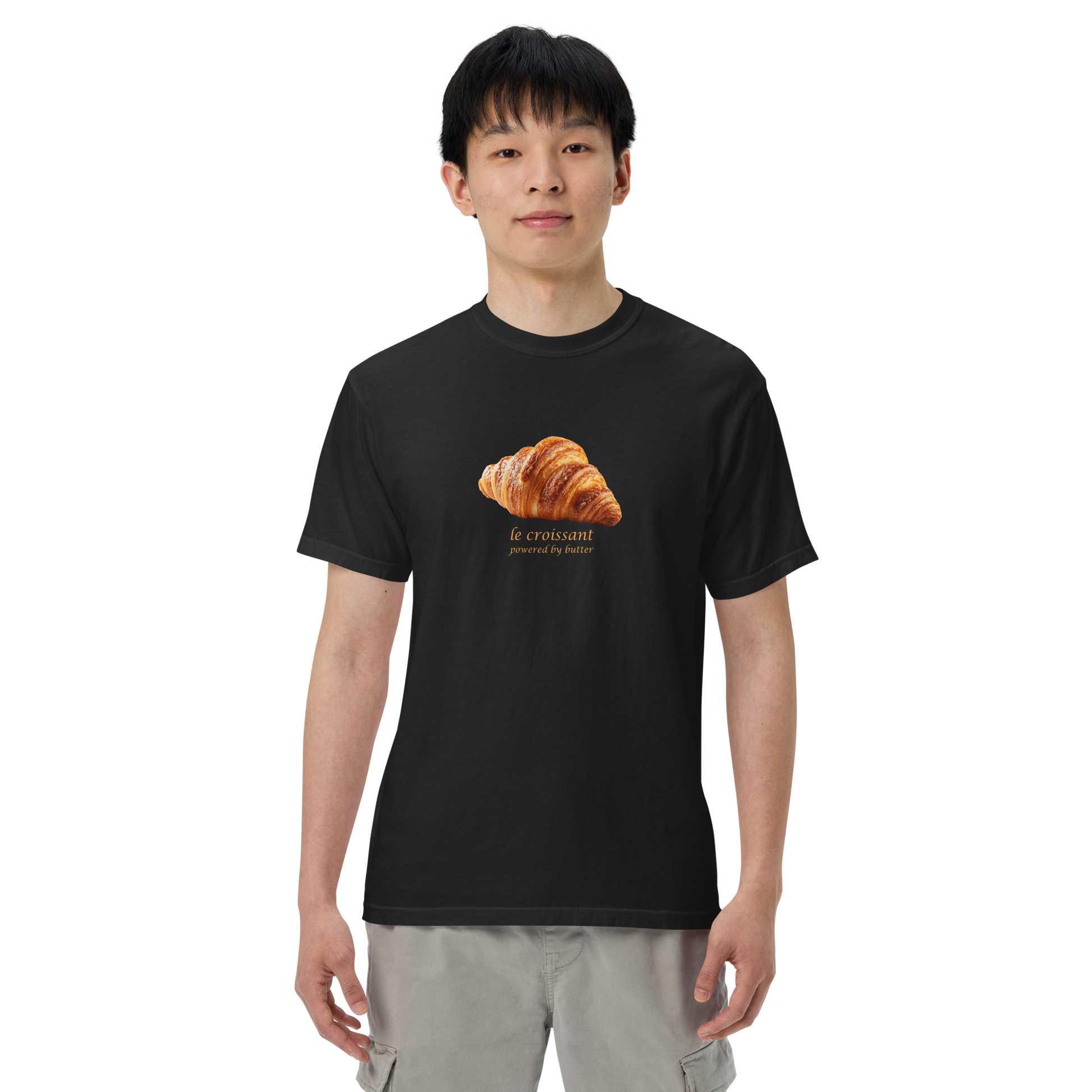Man wearing a Funny Le Croissant heavyweight graphic t-shirt in black by Boozy Fox