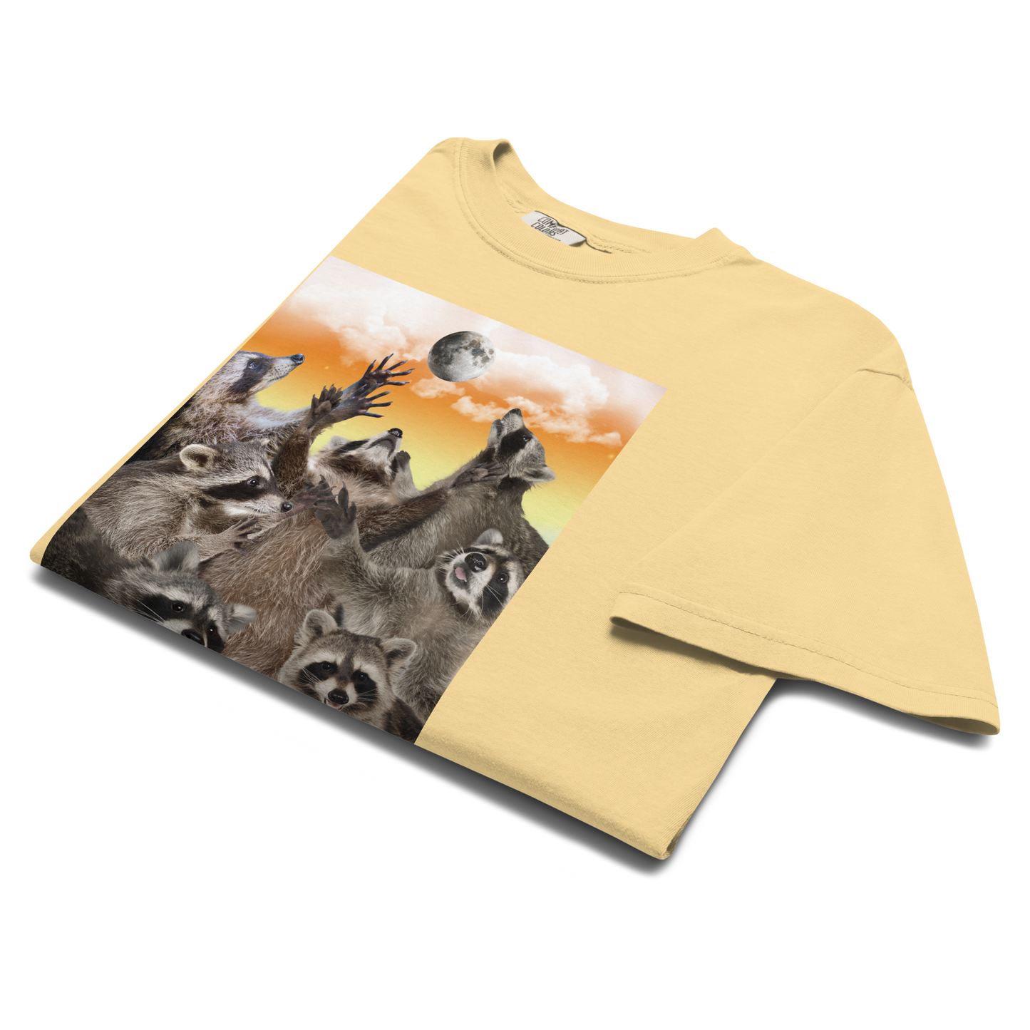 Product details of a Funny In My Feral Era Raccoon heavyweight graphic t-shirt in butter yellow by Boozy Fox