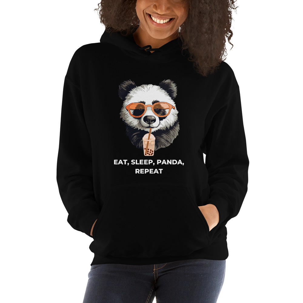 Smiling woman wearing a Black Panda Hoodie featuring the hilarious Eat, Sleep, Panda, Repeat graphic on the chest - Funny Graphic Panda Hoodies - Boozy Fox