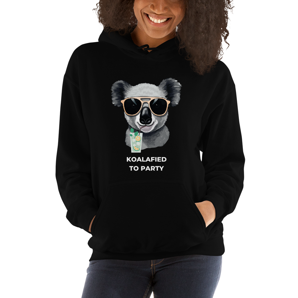 Smiling woman wearing a Black Koala Hoodie featuring a captivating Koalafied To Party graphic on the chest - Funny Graphic Koala Hoodies - Boozy Fox
