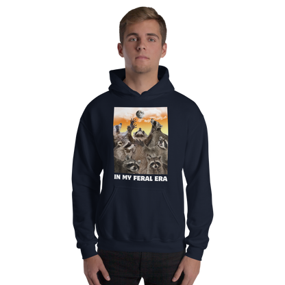Man wearing a Funny In My Feral Era Raccoon graphic hoodie in navy by Boozy Fox