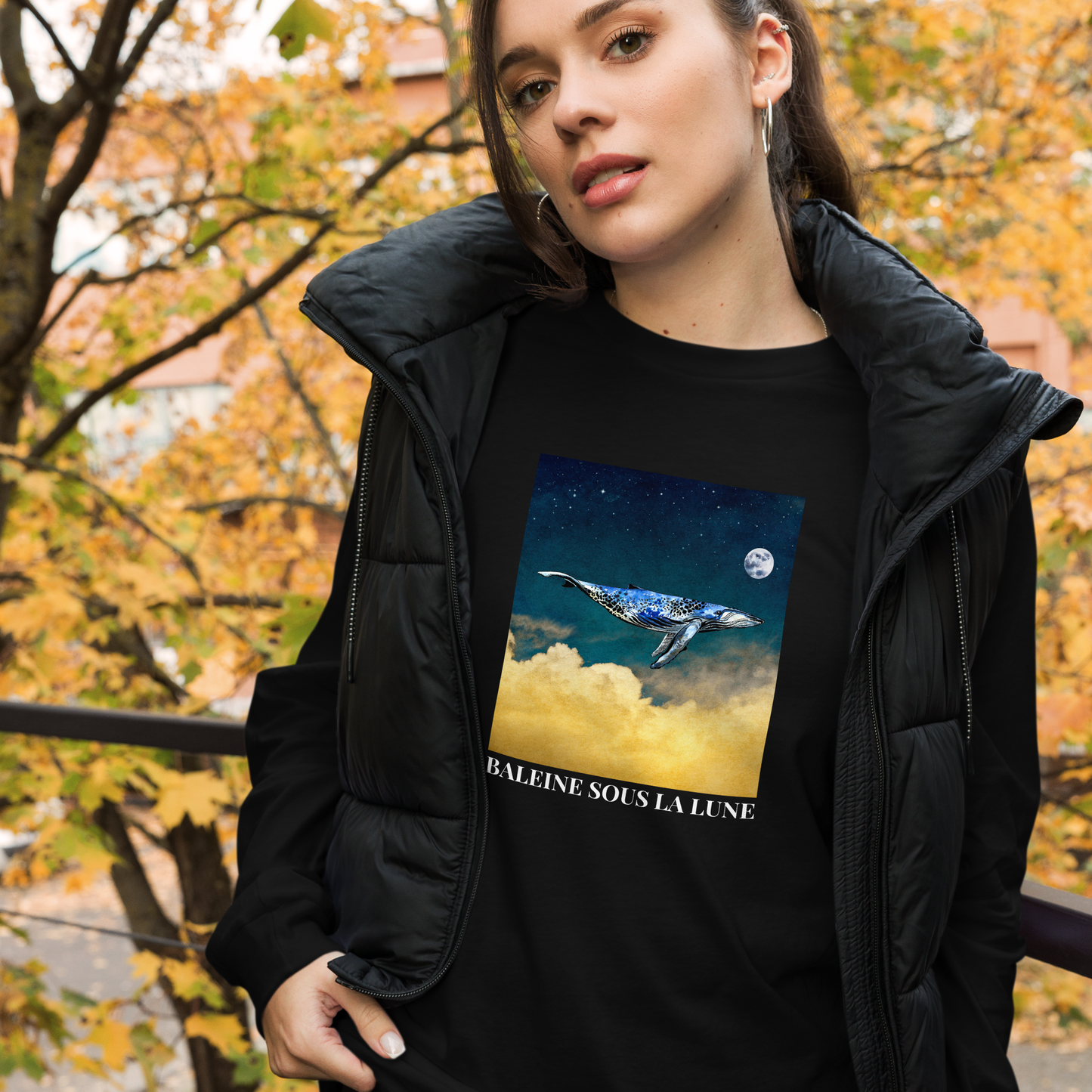 Woman Wearing a Black Whale Long Sleeve Tee featuring a majestic Whale Under The Moon graphic on the chest - Cool Whale Long Sleeve Graphic Tees - Boozy Fox