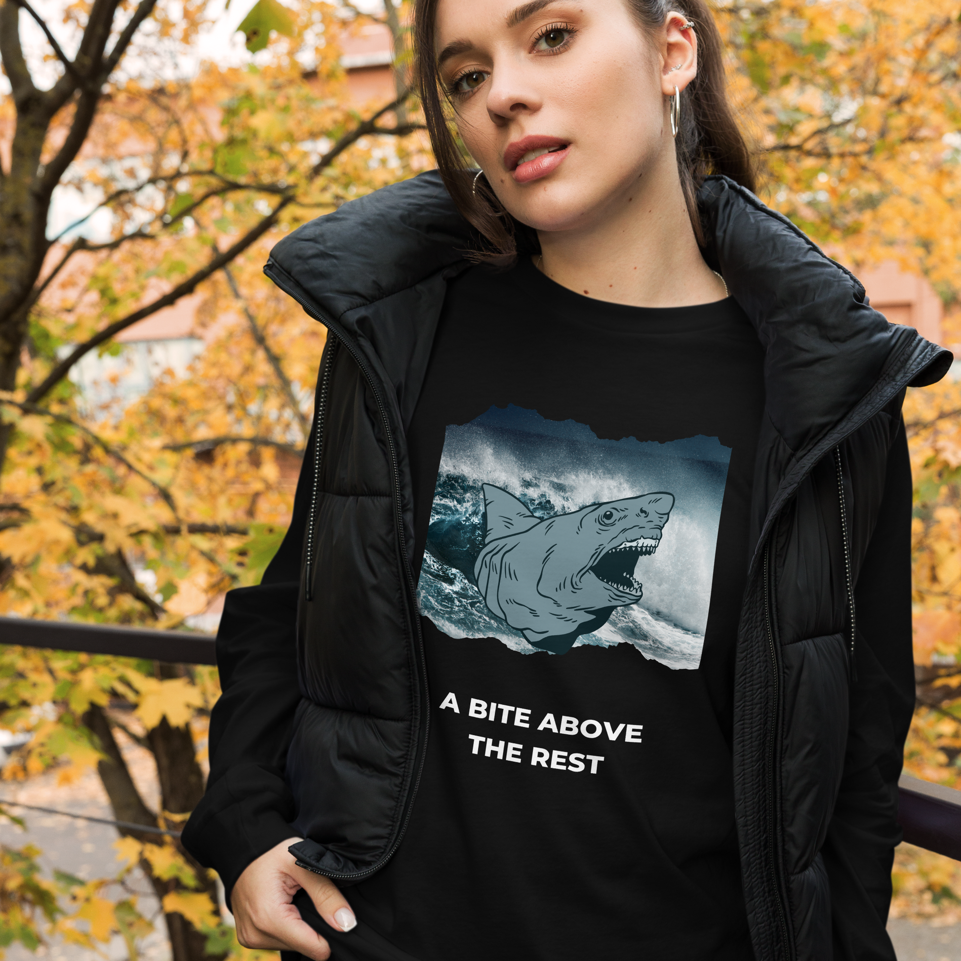 Woman wearing a Black Megalodon Long Sleeve Tee featuring A Bite Above the Rest graphic on the chest - Funny Megalodon Long Sleeve Graphic Tees - Boozy Fox