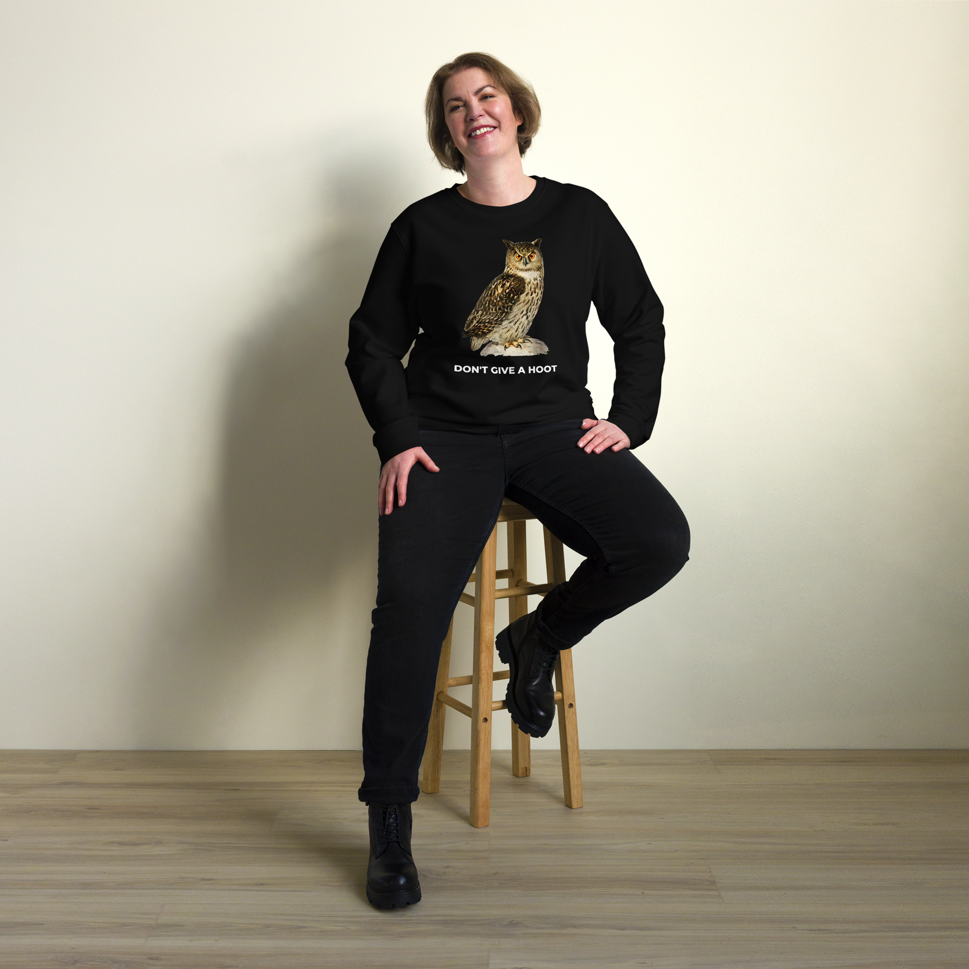 Smiling woman wearing a Black Don't Give A Hoot Owl Organic Cotton Sweatshirt - Boozy Fox