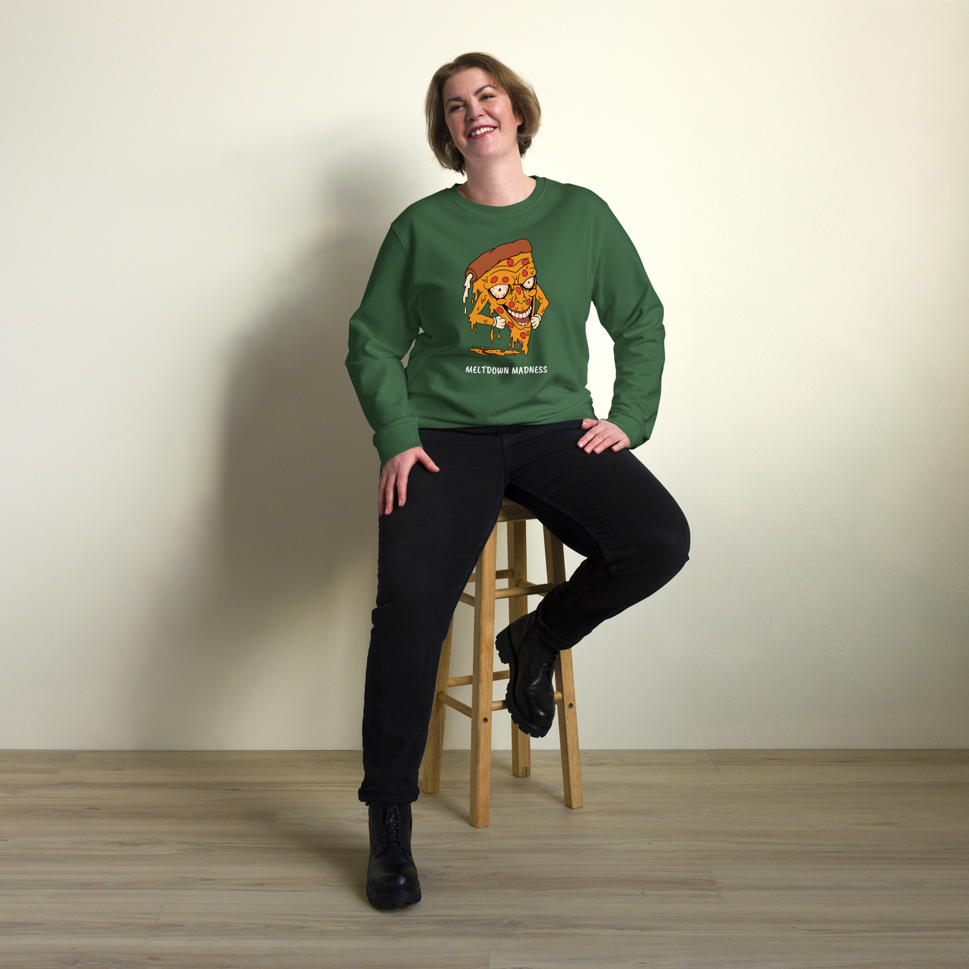 Smiling woman wearing a Bottle Green Organic Cotton Melting Pizza Sweatshirt featuring a Meltdown Madness graphic on the chest - Funny Graphic Pizza Sweatshirts - Boozy Fox